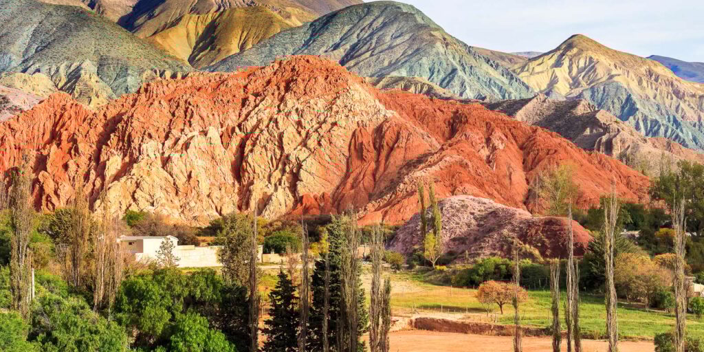 Purmamarca Argentina travel guide – panoramic view of the Hill of Seven Colors and desert village landscape
