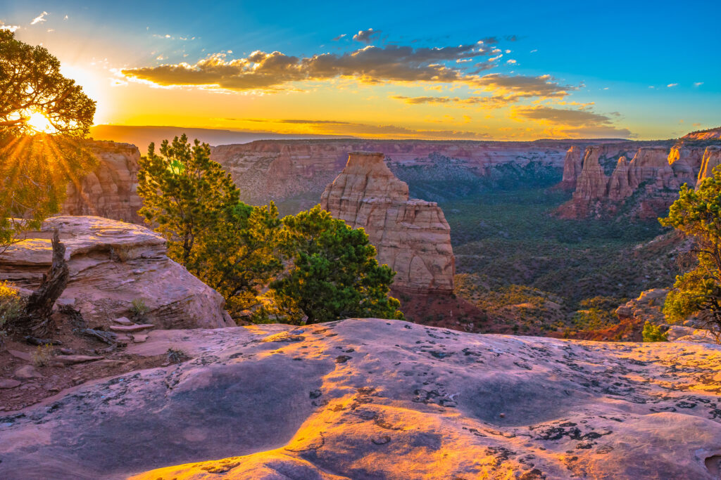 Colorado Travel Guide – Snow-capped Rocky Mountains under a golden sunrise