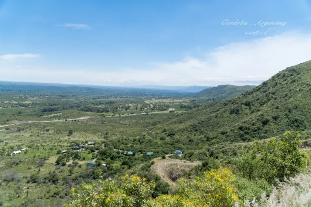 Córdoba Argentina travel guide - panoramic view of Sierras de Córdoba with sunset sky and mountain trails