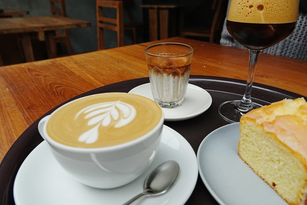 Flat white coffee at a Melbourne café symbolizing modern local food Melbourne