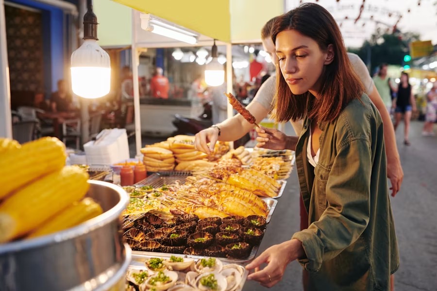 Laneway scene with vibrant stalls offering local food Melbourne to visitors