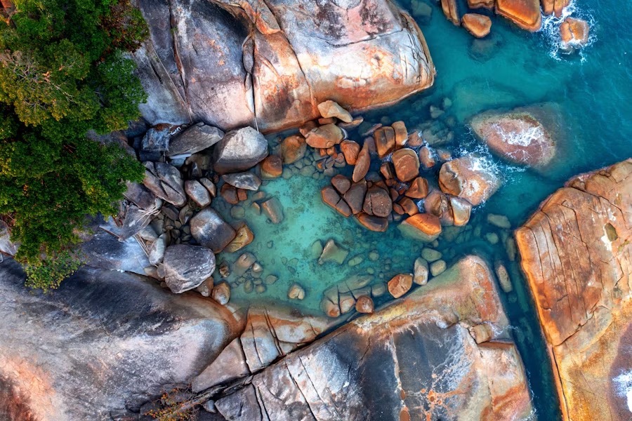 Scenic view of natural hot springs Australia surrounded by nature and mist