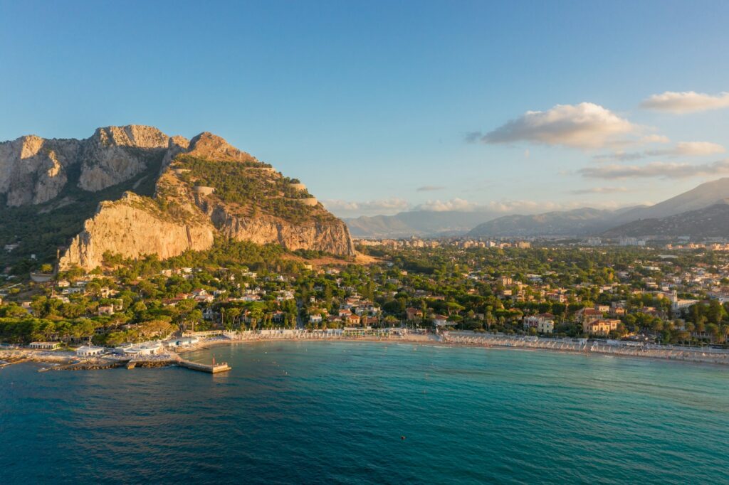 Italy Sicily Mondello 5 Day Itinerary: Sunset over Mondello Beach with golden sand and turquoise water