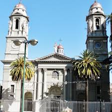 Mercedes Uruguay travel guide – sunset over Río Negro with cathedral and riverside promenade in view