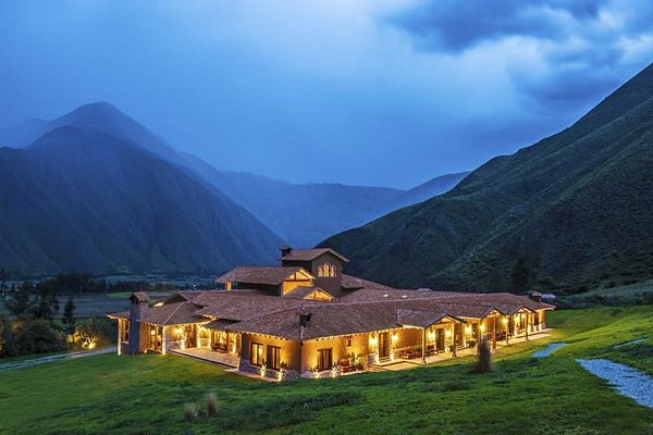A travel photo of Urubamba's Sacred Valley with lush agricultural terraces and snowcapped peaks, perfect for a Urubamba Peru travel guide.
