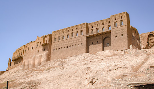 View of Erbil Citadel with Kurdish flags β Ultimate travel guide to Iraq for history lovers