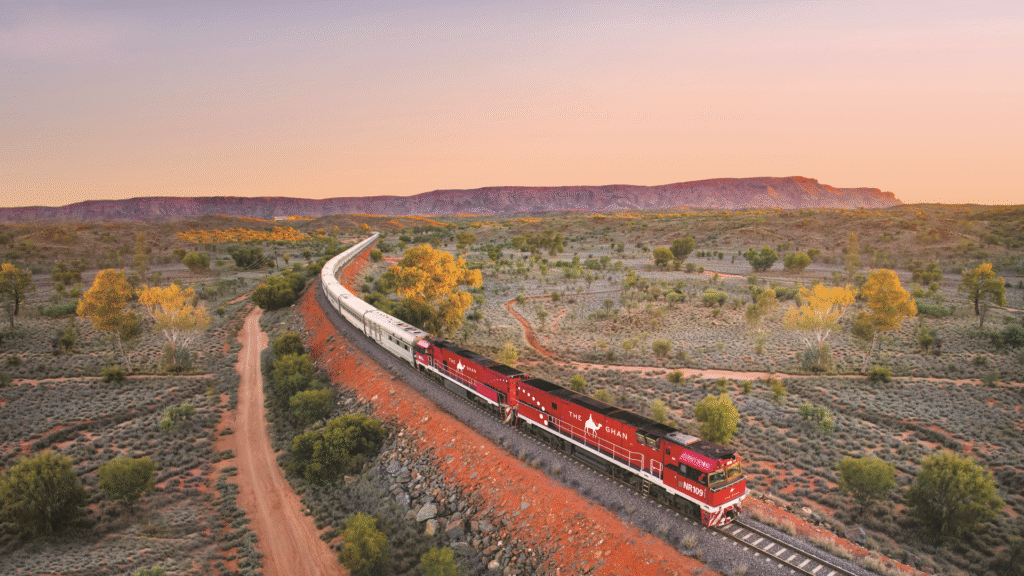 Scenic winter train journeys in Australia through the Red Centre on The Ghan, with views of MacDonnell Ranges and outback sunrise