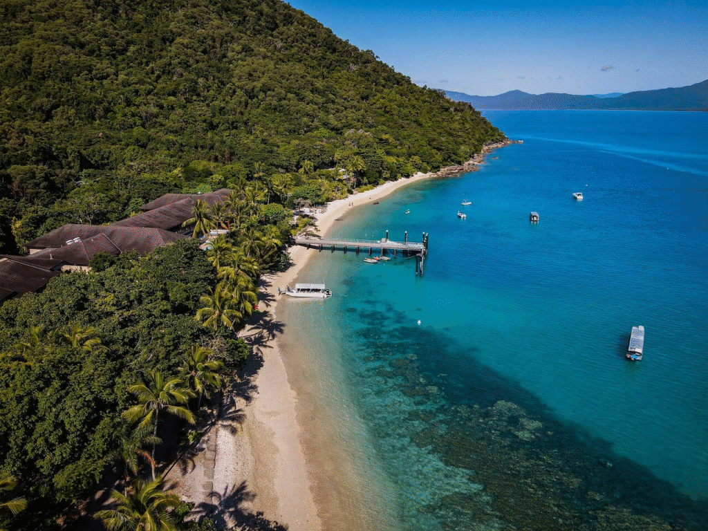 Tropical landscapes and Barrier Reef glimpses captured during scenic winter train journeys in Australia aboard Spirit of Queensland