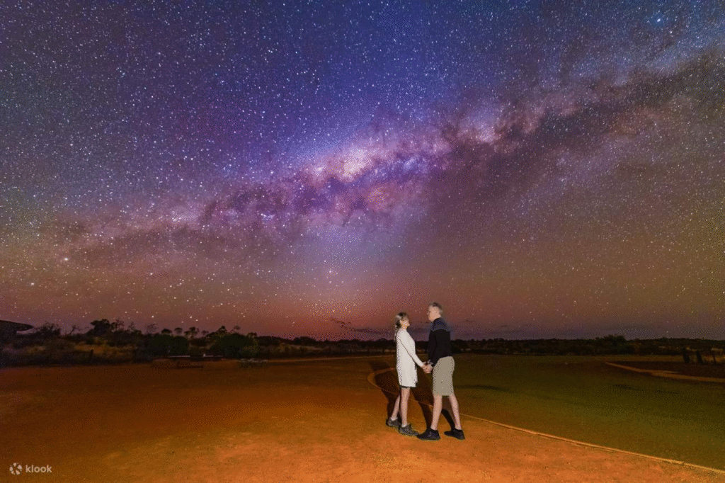 Milky Way shining above Uluru, one of the best places for stargazing Australia adventures
