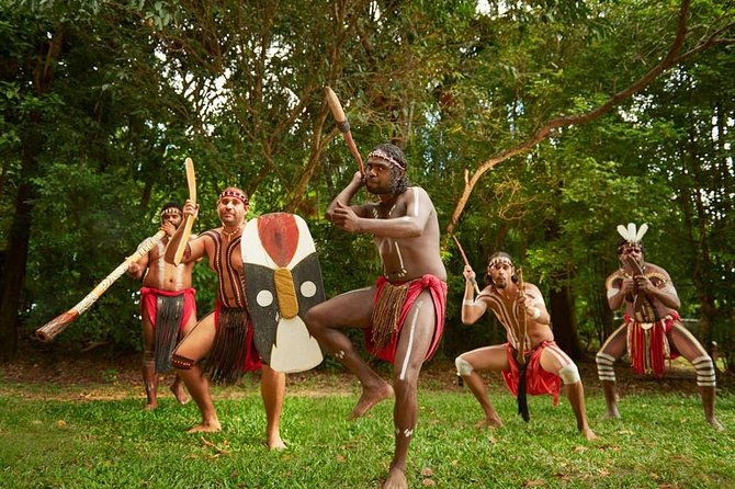Visitors participating in traditional Aboriginal dance at Tjapukai Park highlighting aboriginal experiences Australia
