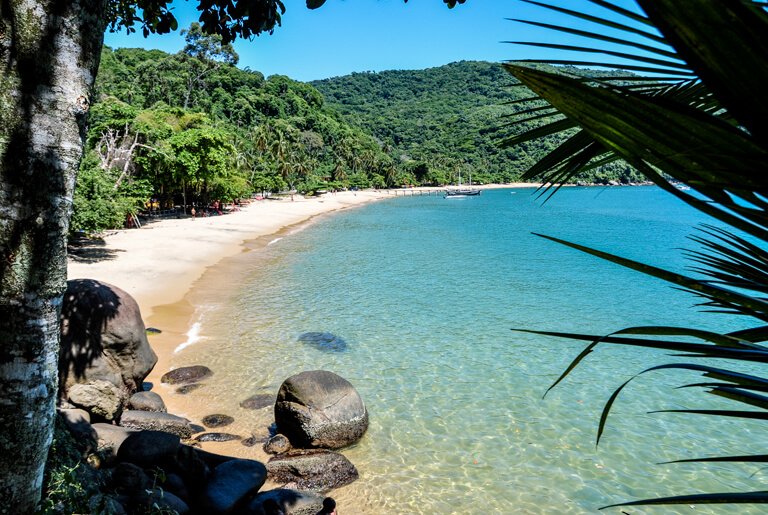Paraty Brazil travel guide - schooner sailing through turquoise bay with green islands