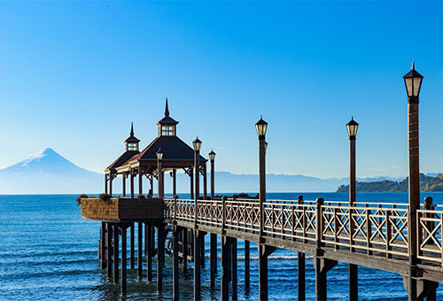 Frutillar Chile travel guide - panoramic view of Lake Llanquihue with Osorno Volcano in the background